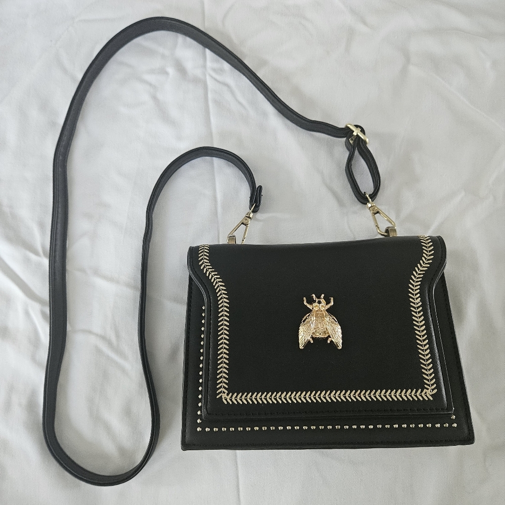 Elegant Black Handbag with Gold Accent
